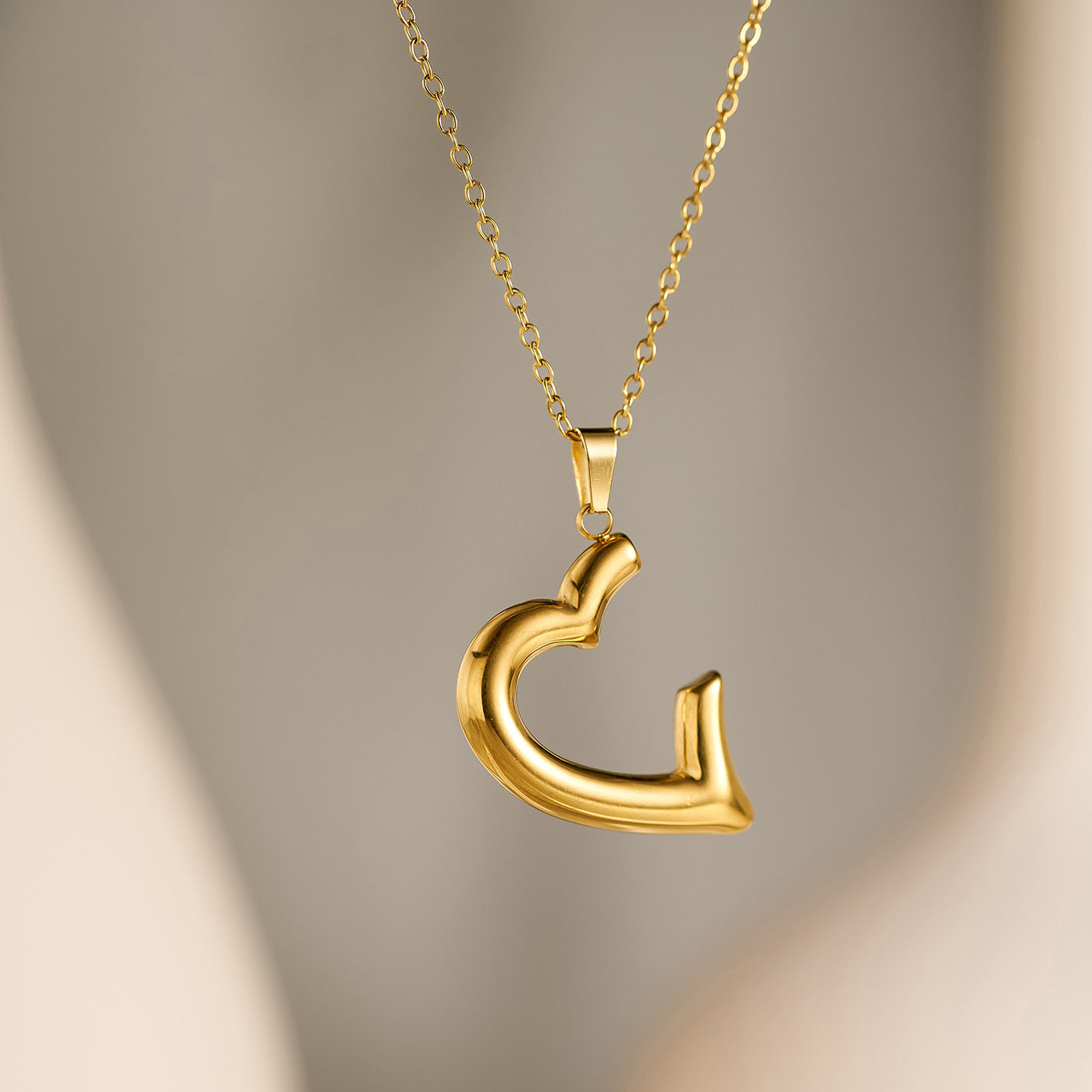 HALF HEART NECKLACE